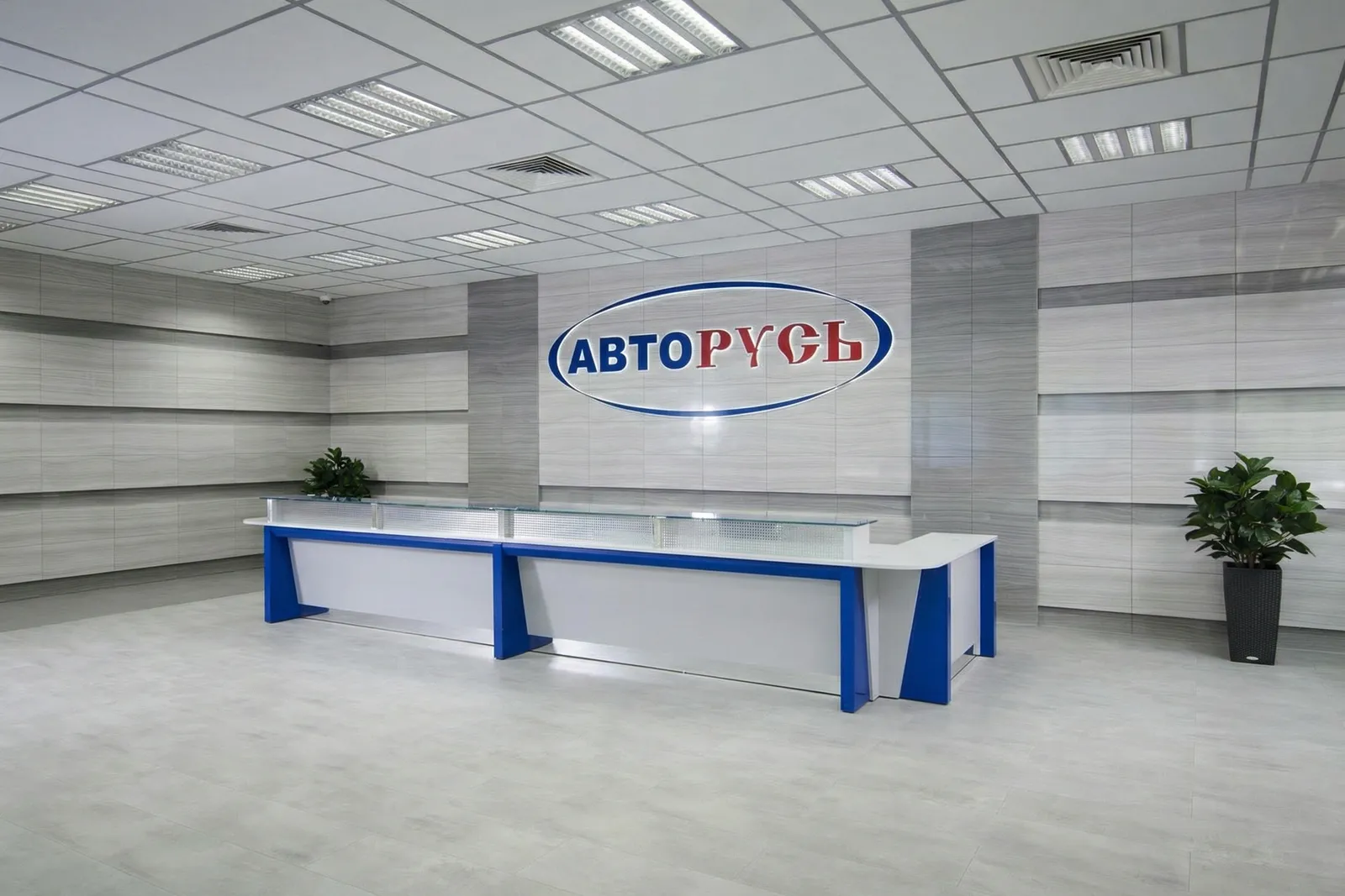 Стойка ресепшн РИ-143 - вариант АвтоРусь Стойка ресепшн РИ-143 в интерьере автоцентра АвтоРусь, корпоративные цвета, хай-тек стиль.